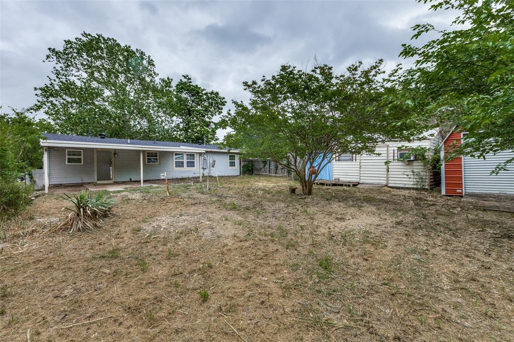 2908 Scottsbluff Drive Dallas, TX 75228 - Photo 33 of 34 front view of a house with a tree