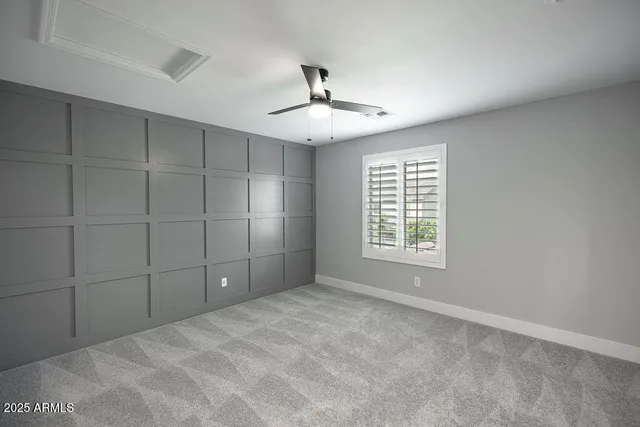 a view of a livingroom with a chandelier fan