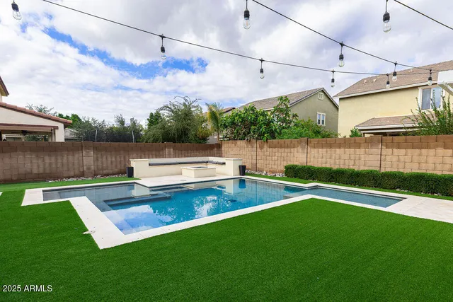 a view of a backyard with sitting area