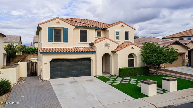 a view of white house with garden
