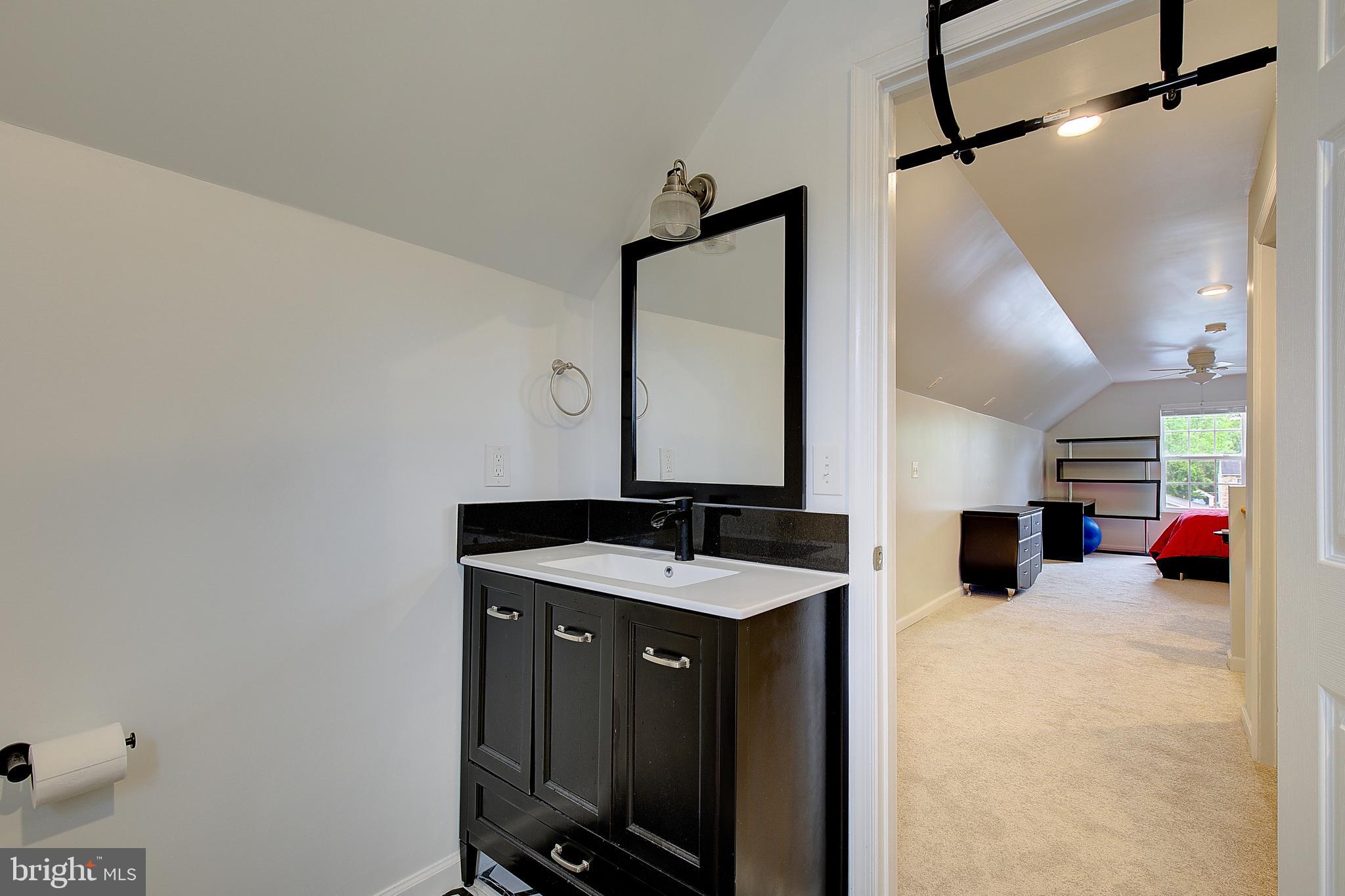 403 Venton Road Edgewater, MD 21037 - Photo 45 of 62 a bathroom with a sink and a mirror