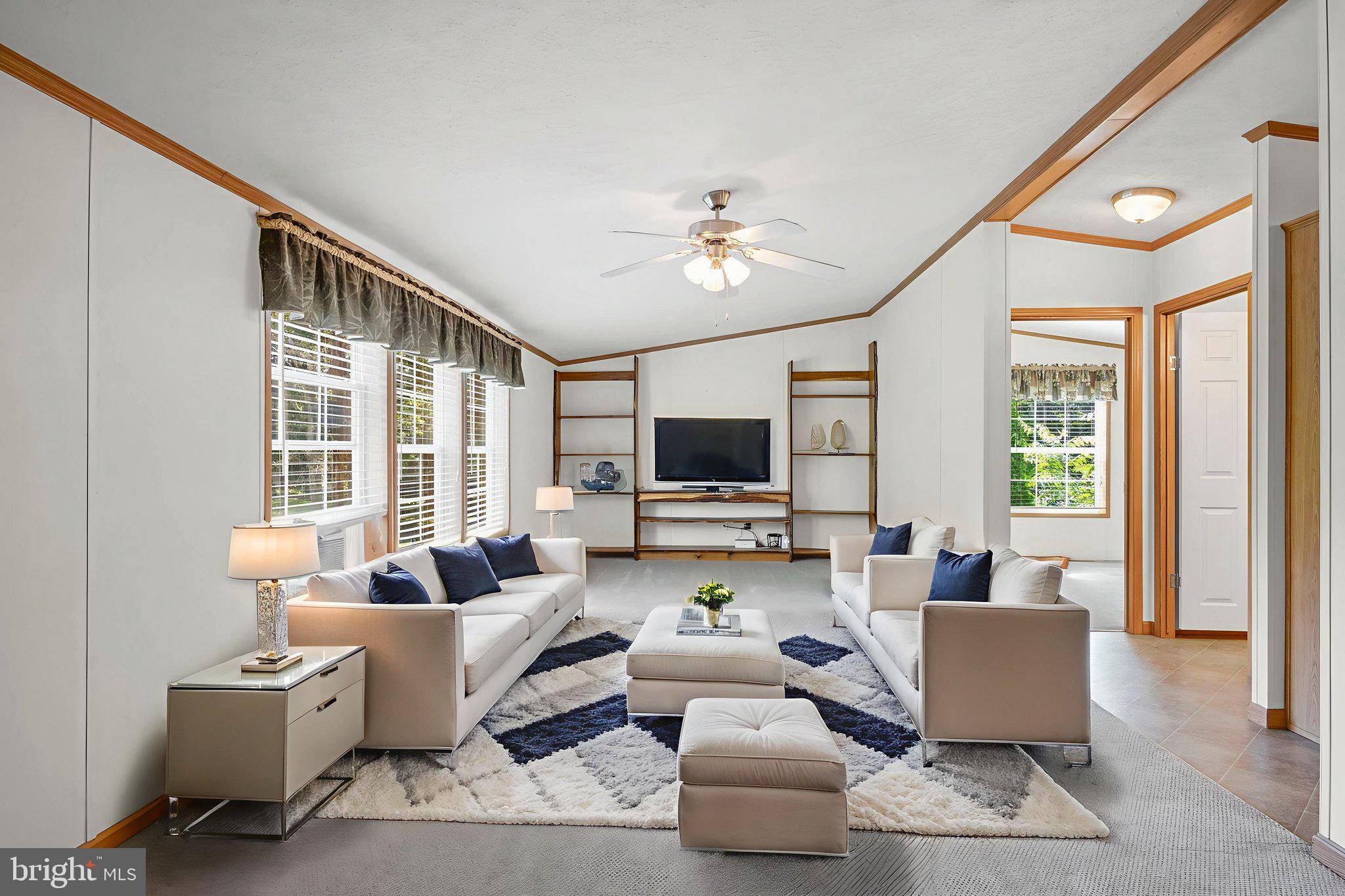 540 Zeigler Road Dover, PA 17315 - Photo 14 of 41 a living room with couches a coffee table and a flat screen tv