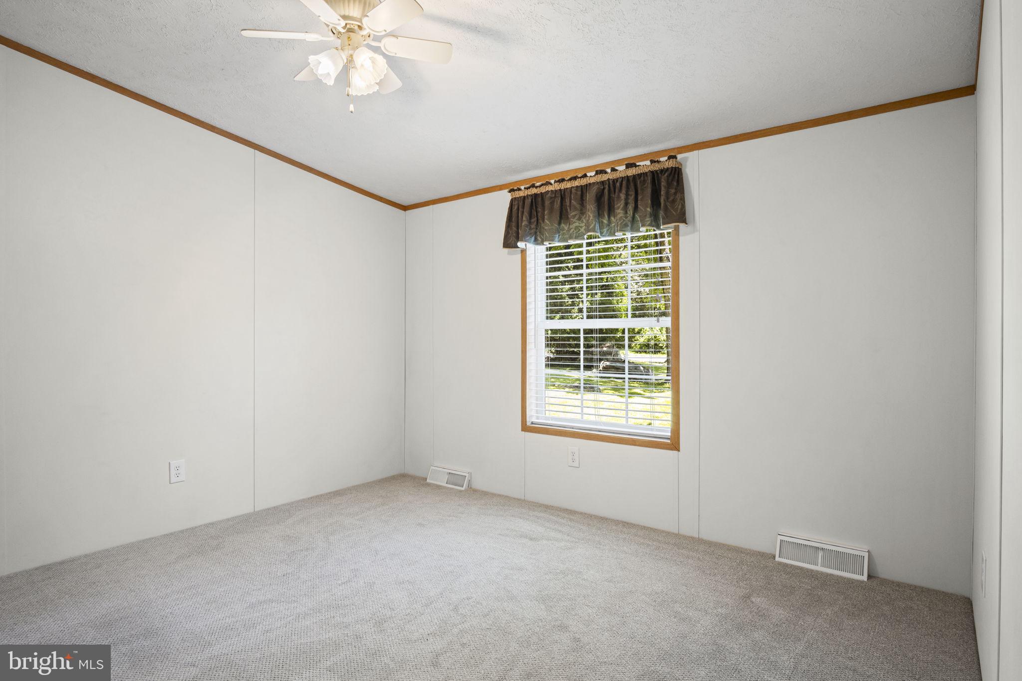 540 Zeigler Road Dover, PA 17315 - Photo 17 of 41 an empty room with windows and fan