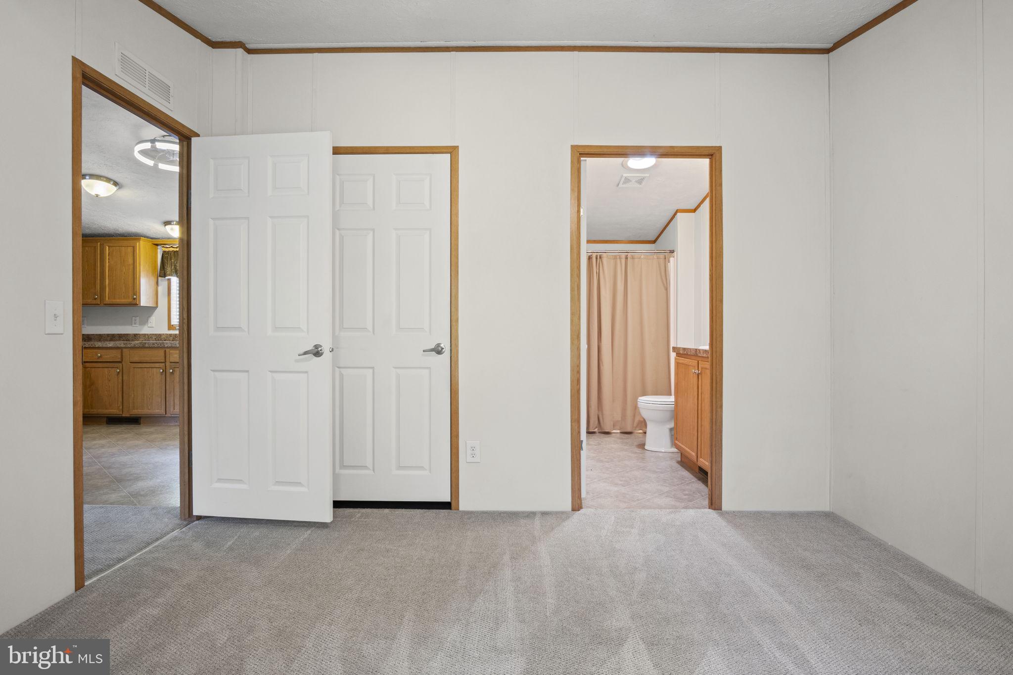 540 Zeigler Road Dover, PA 17315 - Photo 19 of 41 an empty room and a bathroom with mirror