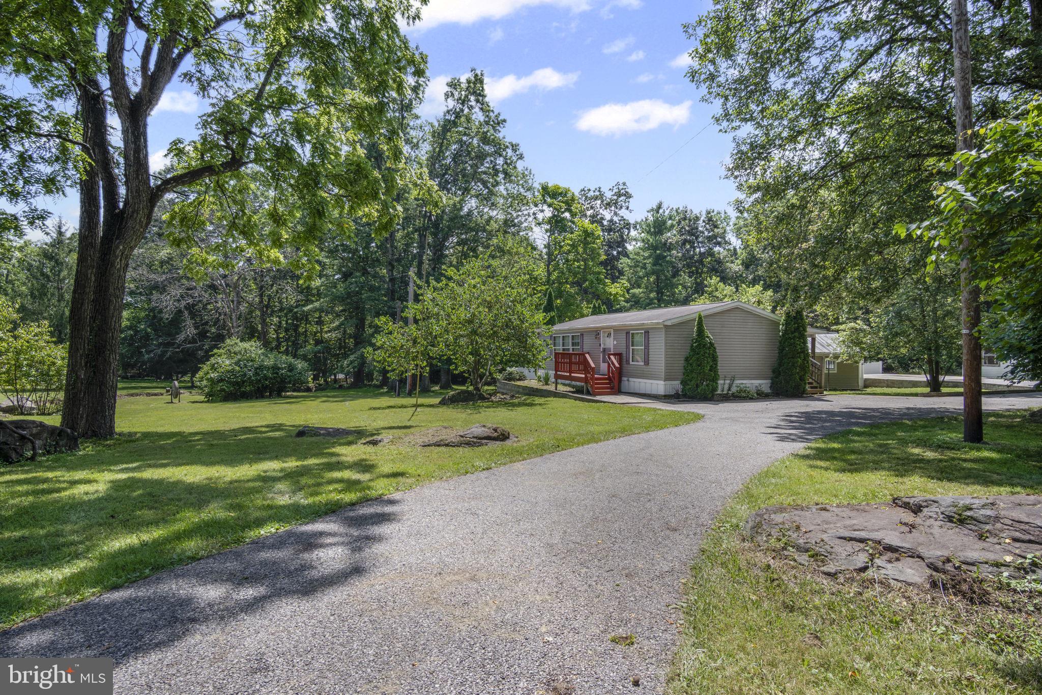 540 Zeigler Road Dover, PA 17315 - Photo 2 of 41 a front view of a house with a yard and trees