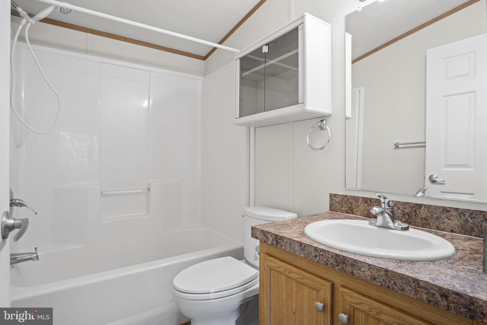 540 Zeigler Road Dover, PA 17315 - Photo 26 of 41 a bathroom with a granite countertop sink toilet and shower