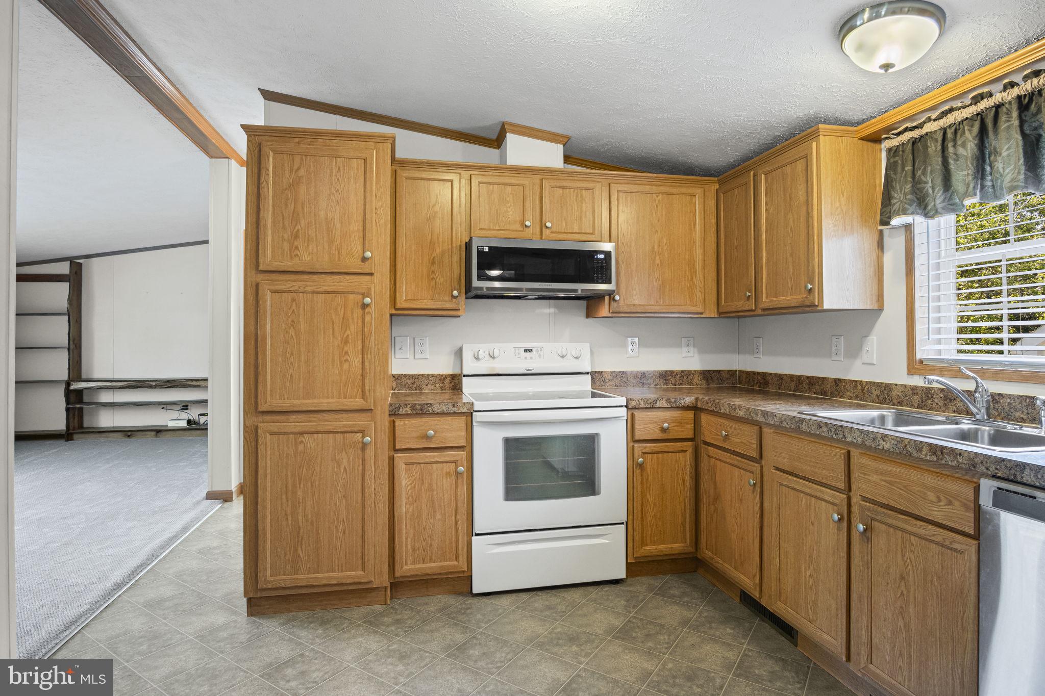 540 Zeigler Road Dover, PA 17315 - Photo 30 of 41 a kitchen with a refrigerator stove and sink