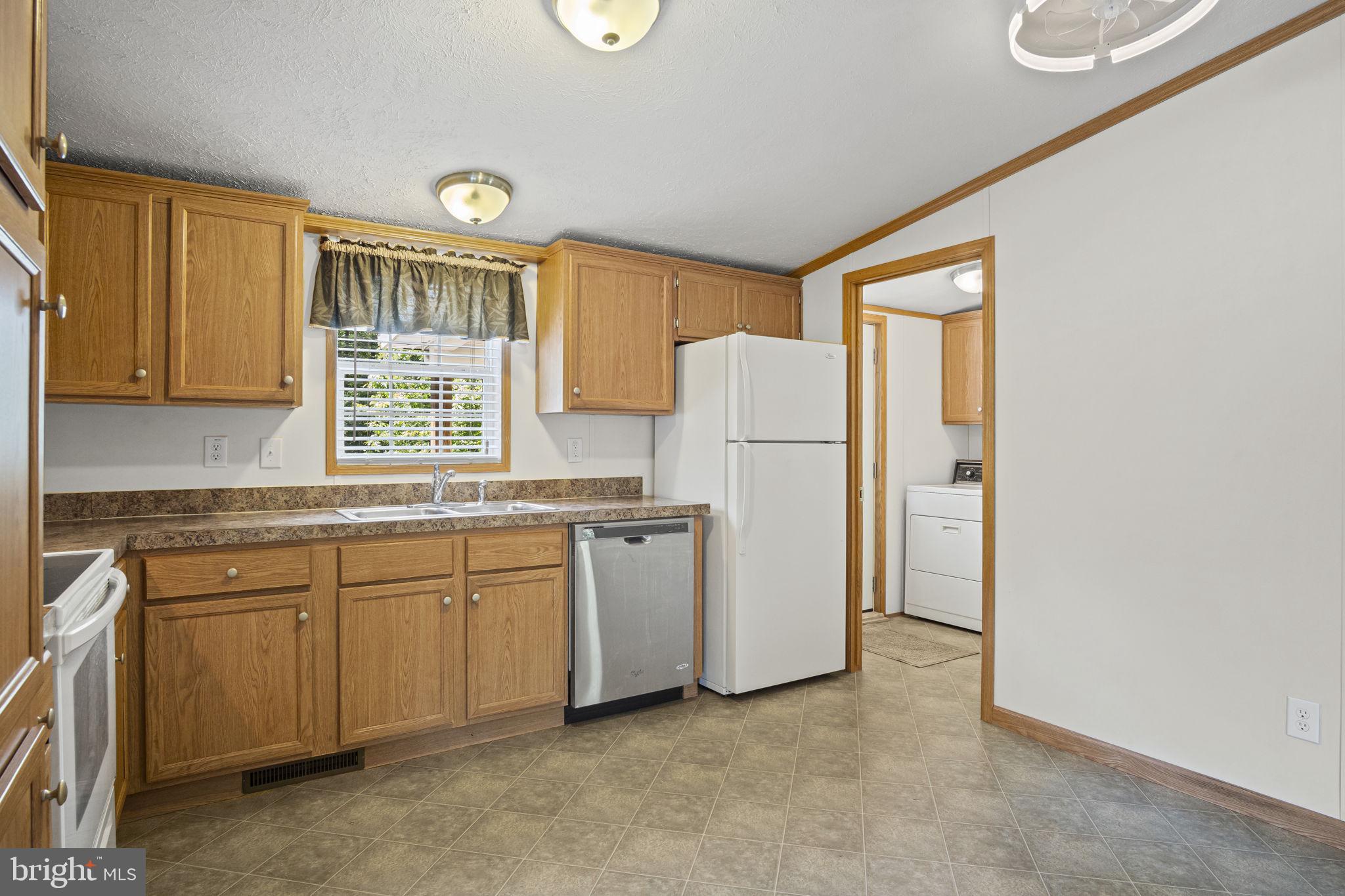 540 Zeigler Road Dover, PA 17315 - Photo 31 of 41 a kitchen with refrigerator and window