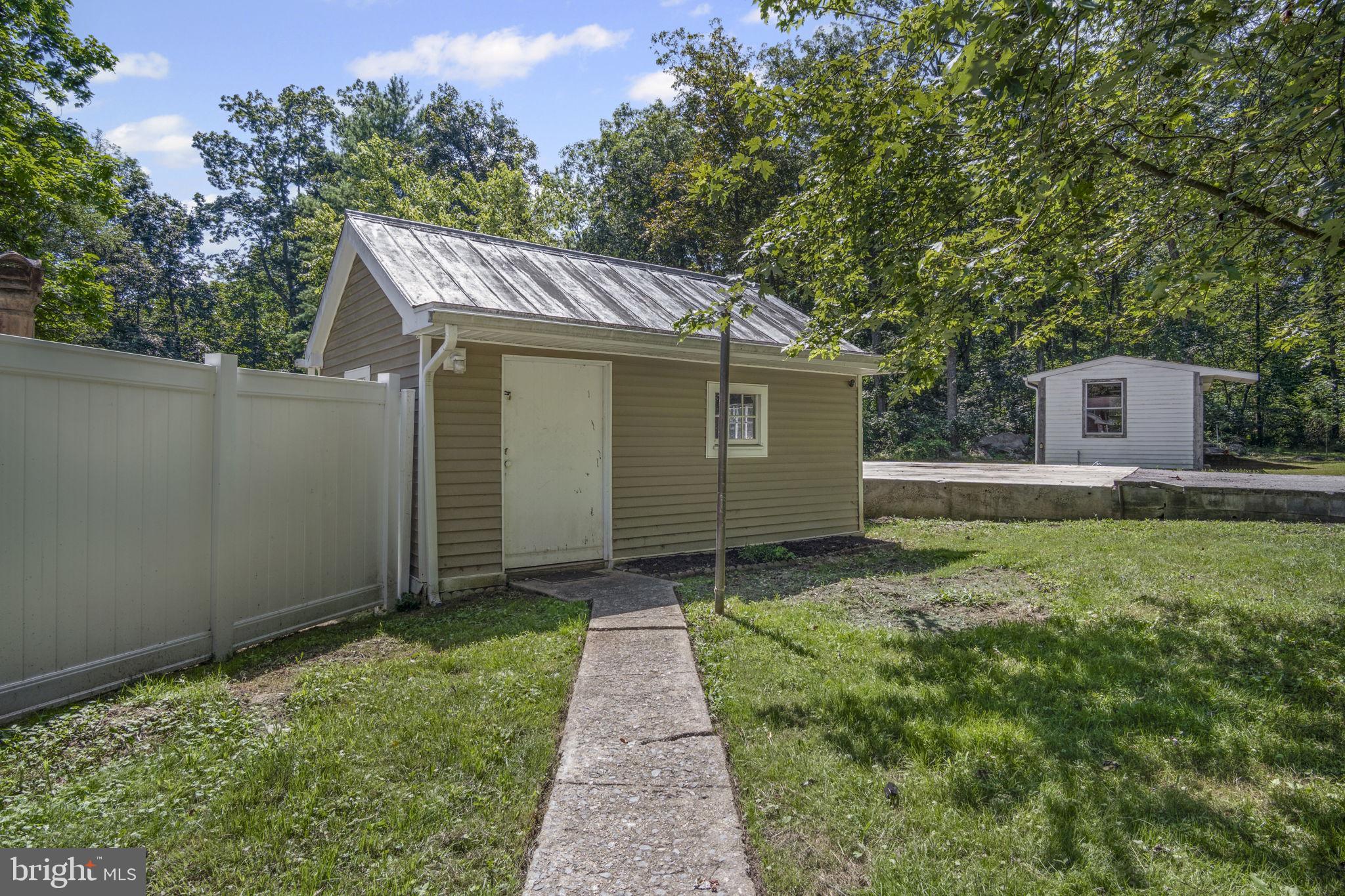 540 Zeigler Road Dover, PA 17315 - Photo 32 of 41 a backyard of a house with plants and trees