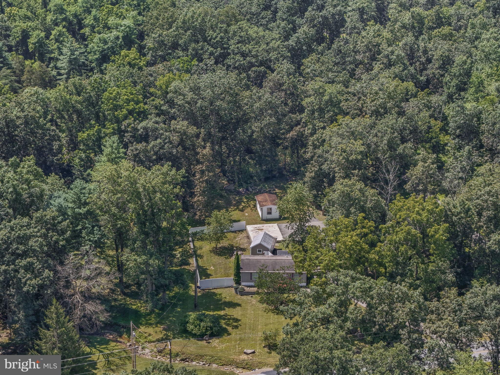 540 Zeigler Road Dover, PA 17315 - Photo 10 of 41 a wooden bench sitting in a forest