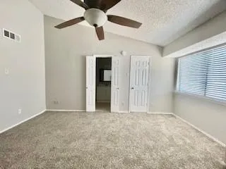 a view of an empty room with a window