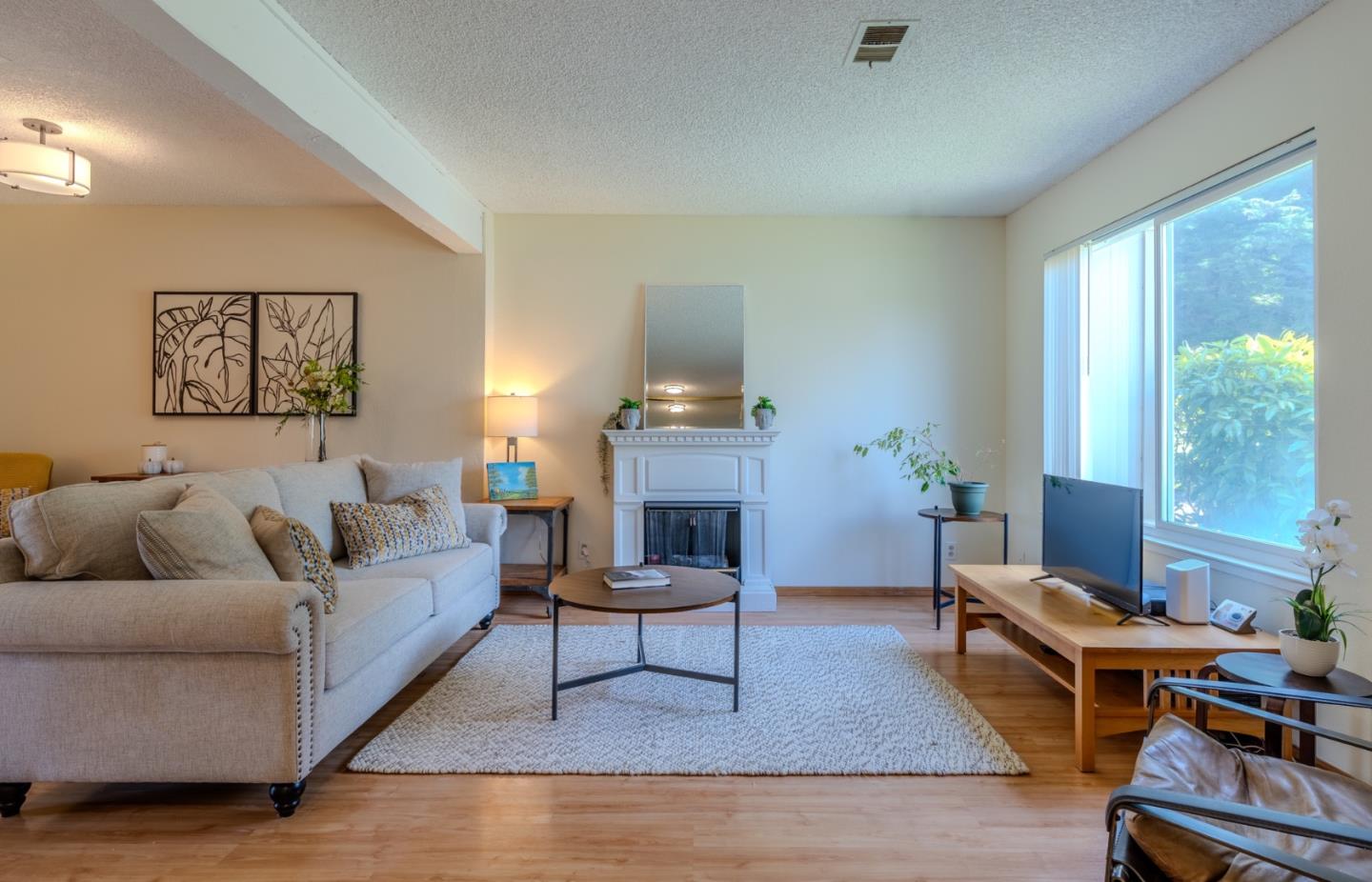 1263 Rosita Road Pacifica, CA 94044 - Photo 2 of 37 a living room with furniture and a fireplace