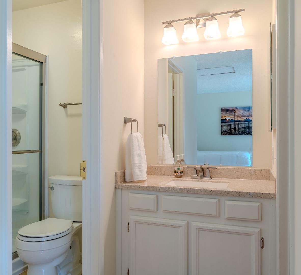 1263 Rosita Road Pacifica, CA 94044 - Photo 23 of 37 a bathroom with a sink and a mirror