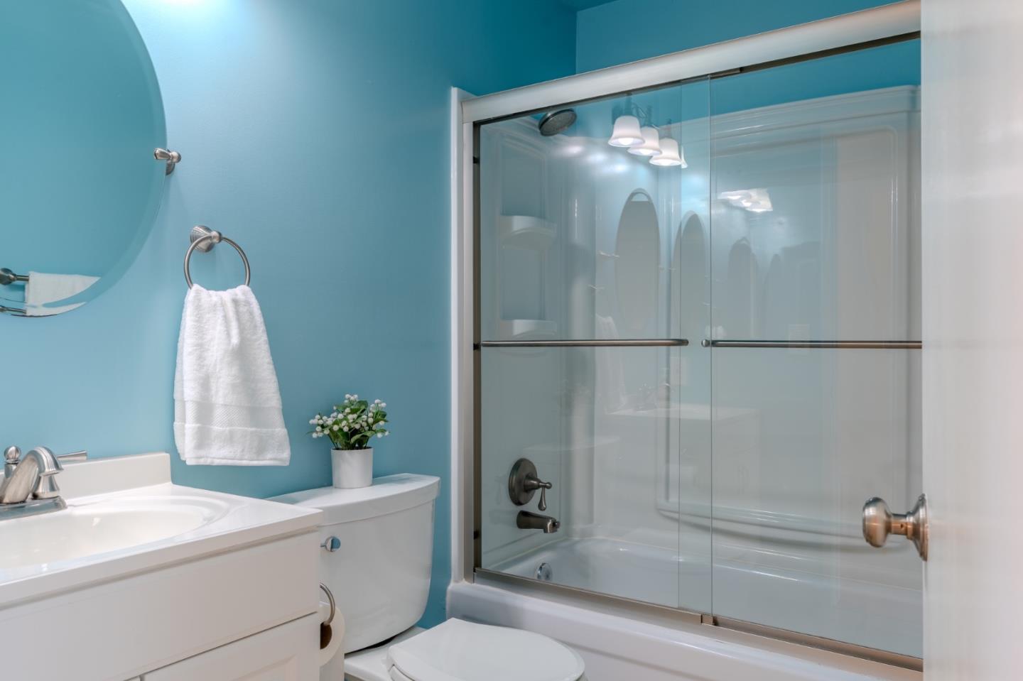 1263 Rosita Road Pacifica, CA 94044 - Photo 28 of 37 a bathroom with a shower a sink and mirror