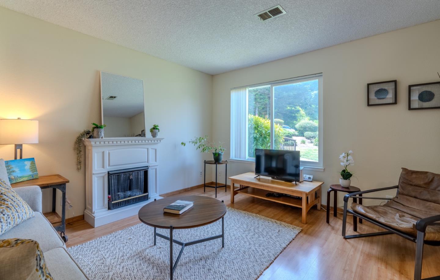 1263 Rosita Road Pacifica, CA 94044 - Photo 5 of 37 a living room with furniture and a fireplace