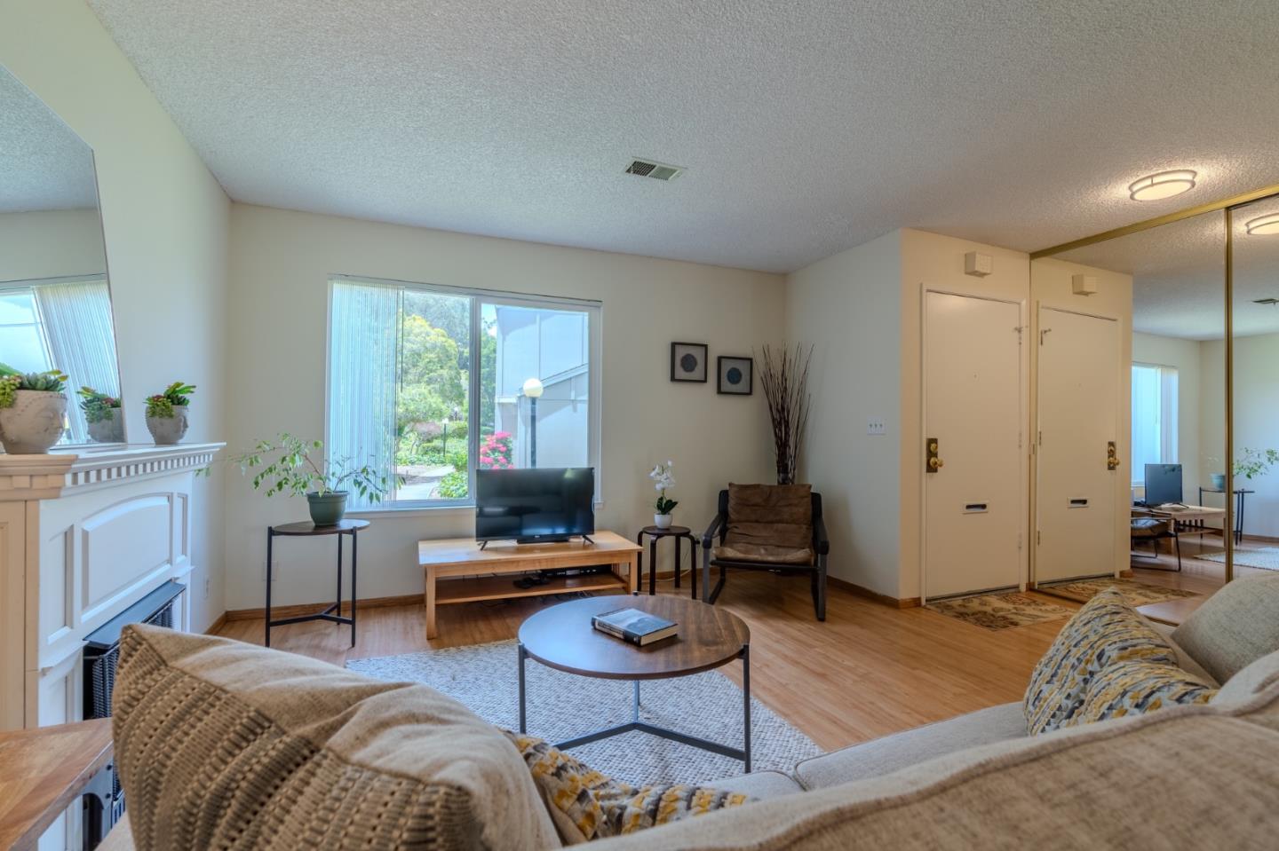 1263 Rosita Road Pacifica, CA 94044 - Photo 6 of 37 a living room with furniture and a wooden floor