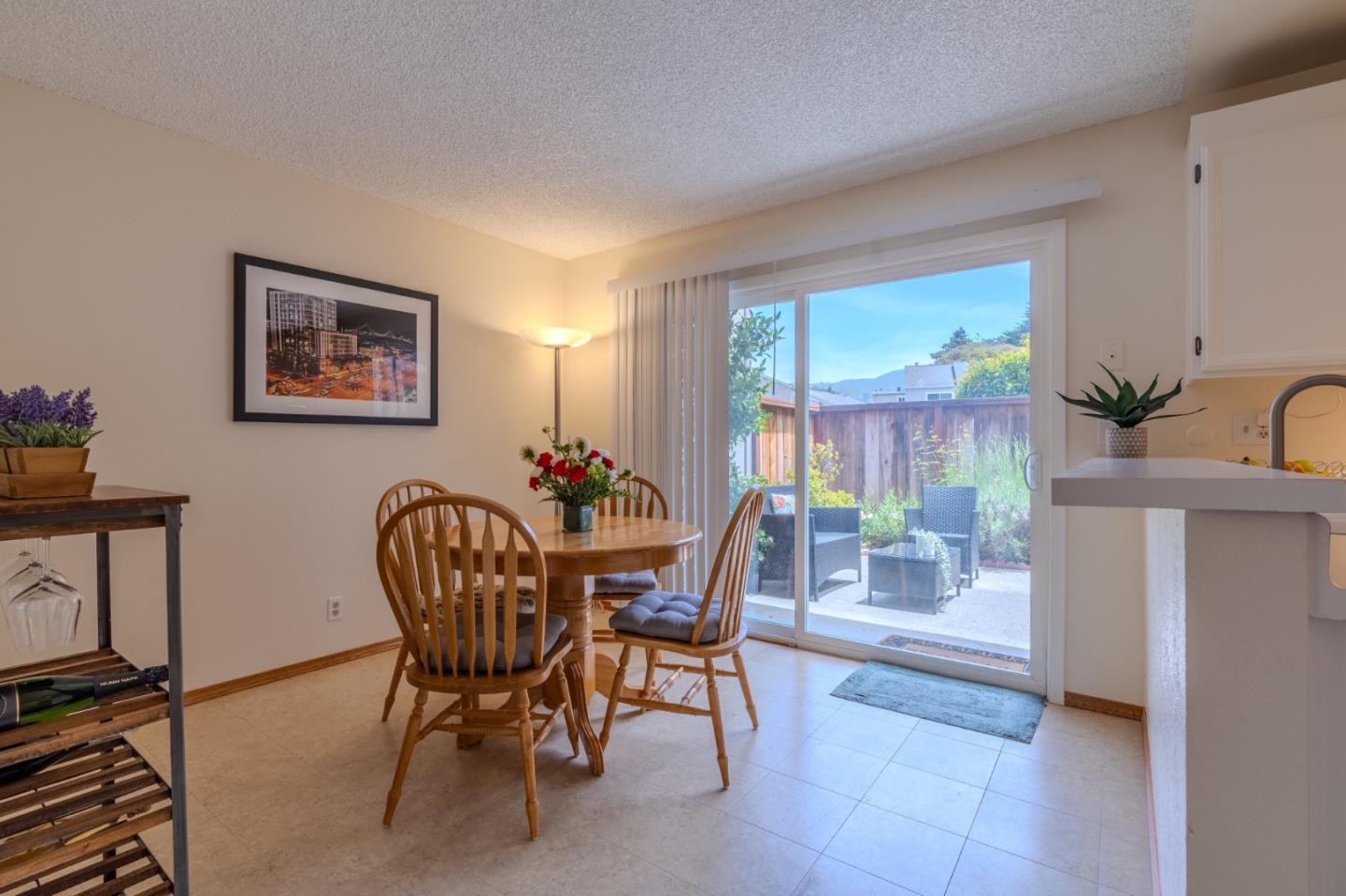 1263 Rosita Road Pacifica, CA 94044 - Photo 10 of 37 a dining room with furniture and wooden floor