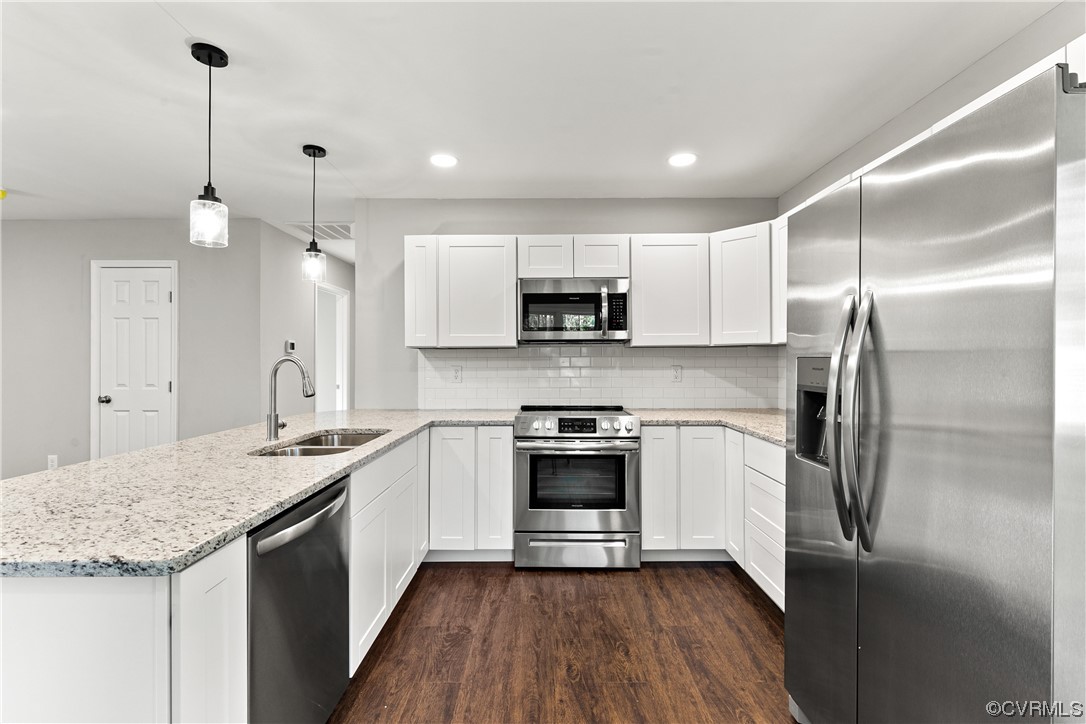 15406 Saddlebrook Road Chesterfield, VA 23838 - Photo 12 of 36 a kitchen with a sink stainless steel appliances and white cabinets