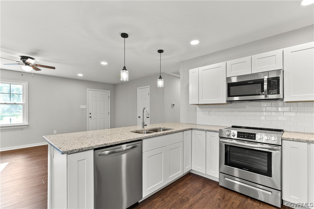 15406 Saddlebrook Road Chesterfield, VA 23838 - Photo 13 of 36 a kitchen with a sink stove and microwave