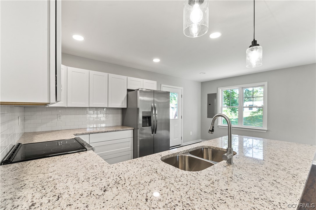15406 Saddlebrook Road Chesterfield, VA 23838 - Photo 15 of 36 a kitchen with stainless steel appliances granite countertop a sink stove and refrigerator