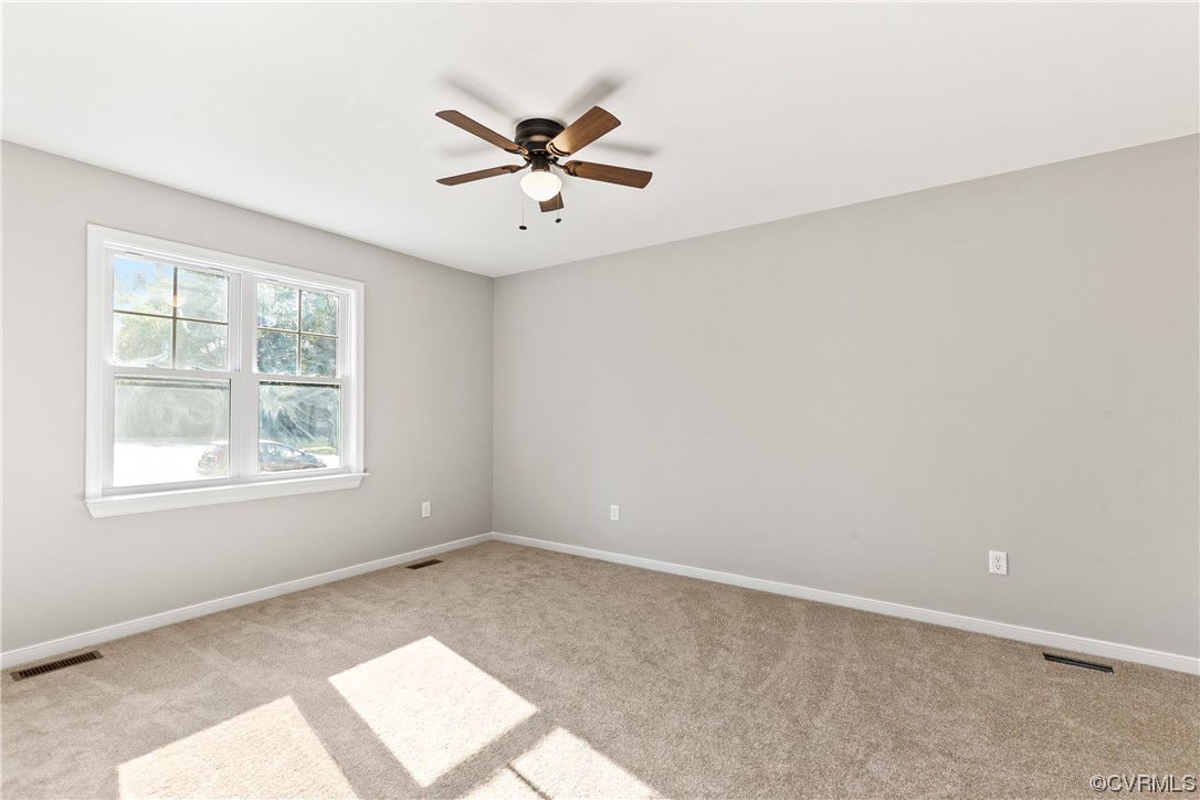 15406 Saddlebrook Road Chesterfield, VA 23838 - Photo 22 of 36 an empty room with windows and fan