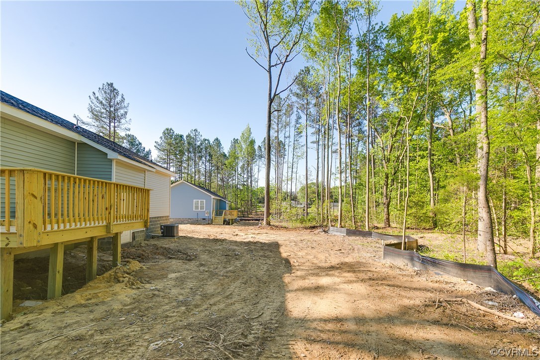 15406 Saddlebrook Road Chesterfield, VA 23838 - Photo 35 of 36 a backyard of a house with table and chairs