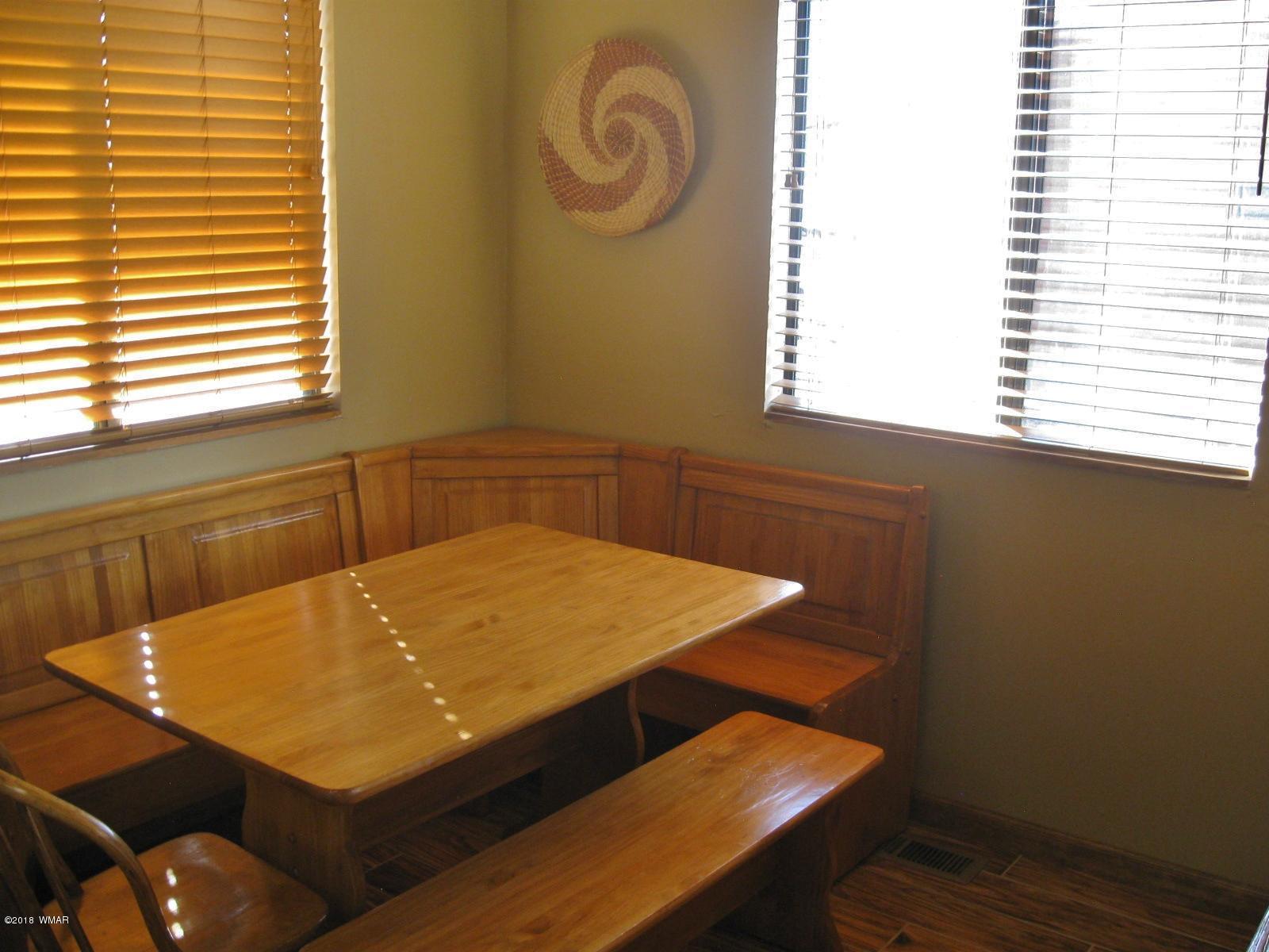 140 Main Street, Unit 4 Greer, AZ 85927 - Photo 14 of 20 a room with a table chairs and a window