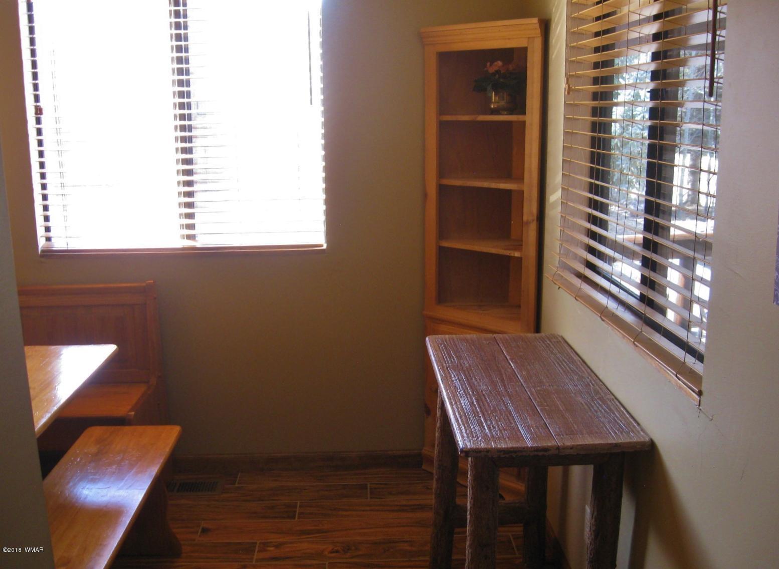 140 Main Street, Unit 4 Greer, AZ 85927 - Photo 15 of 20 a view of a hallway with furniture and a window