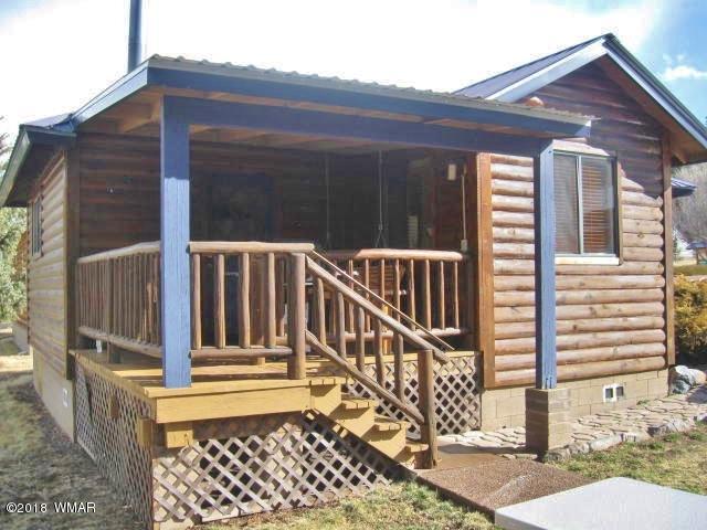 140 Main Street, Unit 4 Greer, AZ 85927 - Photo 2 of 20 a view of a house with wooden fence