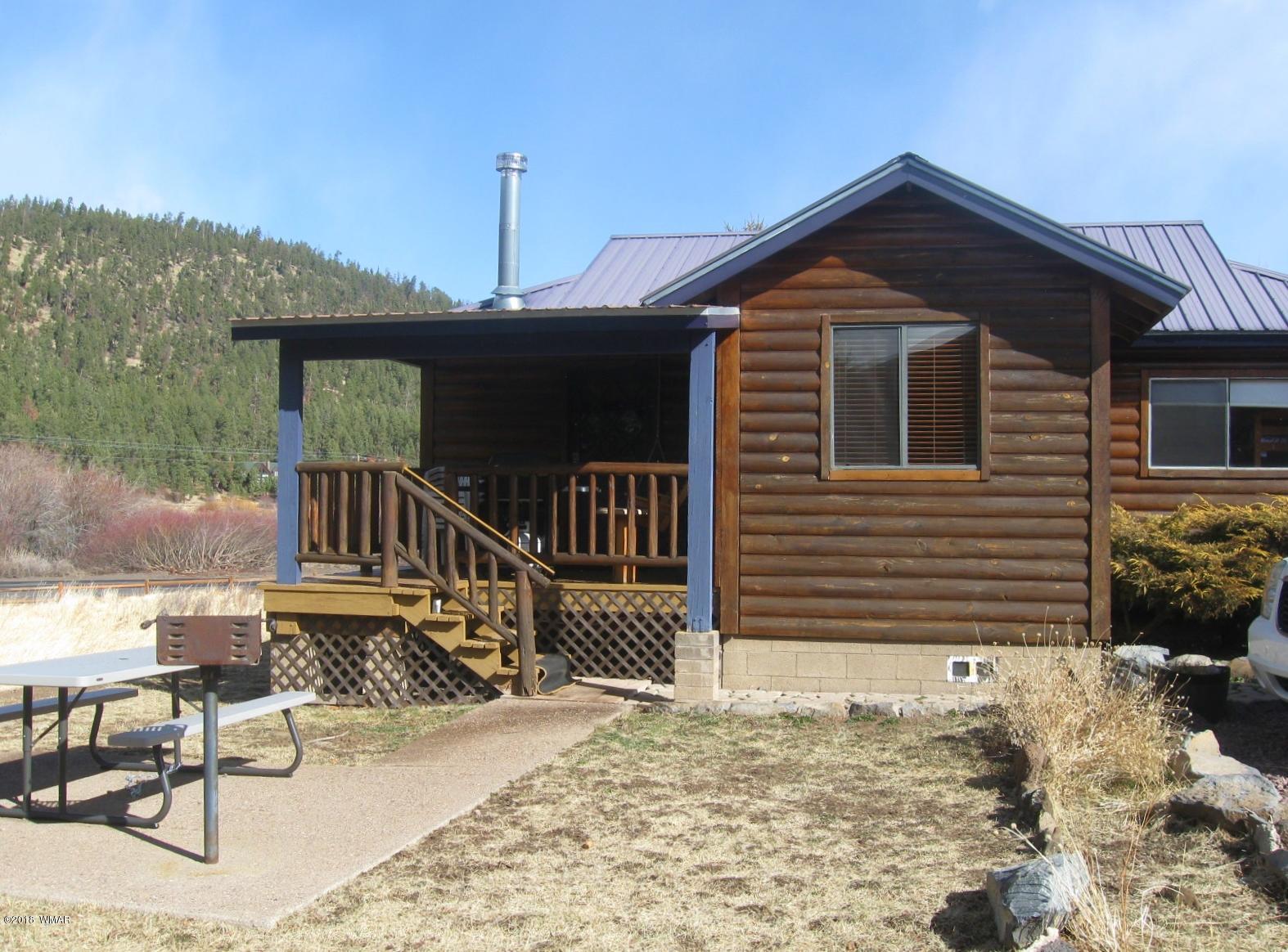 140 Main Street, Unit 4 Greer, AZ 85927 - Photo 4 of 20 a front view of house with yard