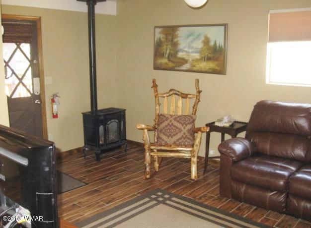 140 Main Street, Unit 4 Greer, AZ 85927 - Photo 8 of 20 a view of a livingroom with furniture and a couch