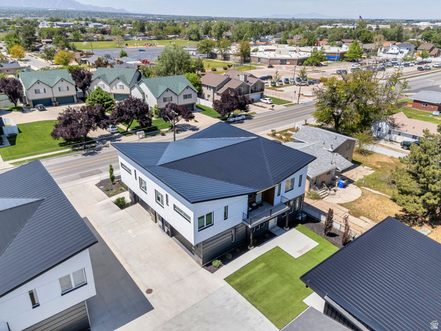 7045 South 300 East Midvale, UT 84047 - Photo 43 of 49 Modern architectural design featuring a prominent black metal roof