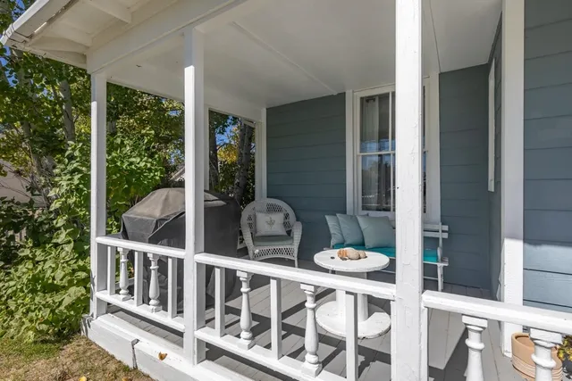 a backyard of a house with outdoor seating