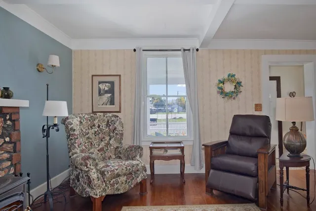 a bedroom with furniture and wooden floor