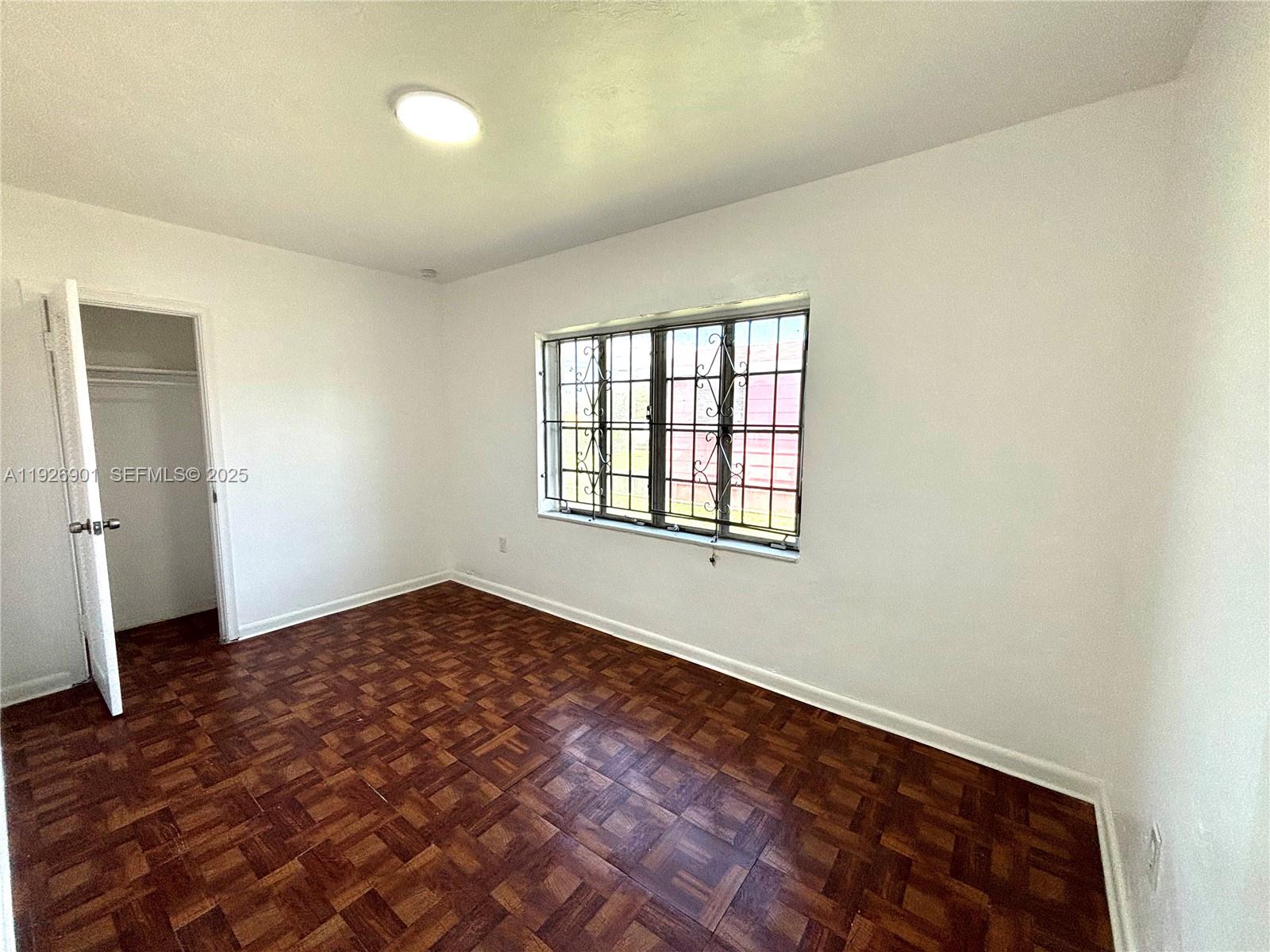 2145 Northwest 64th Street Miami, FL 33147 - Photo 15 of 21 an empty room with windows