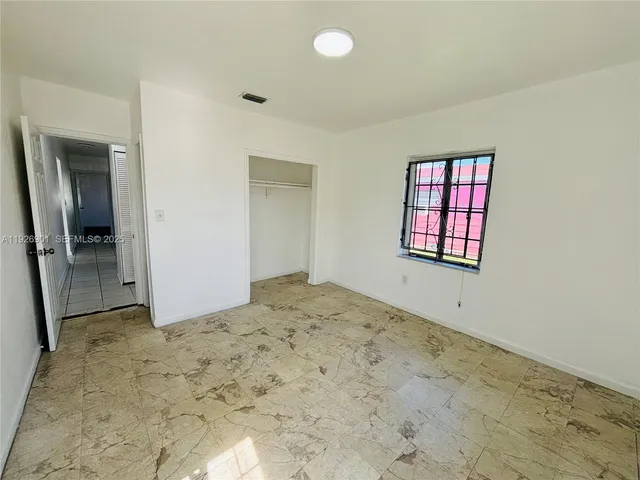 an empty room with a bathroom