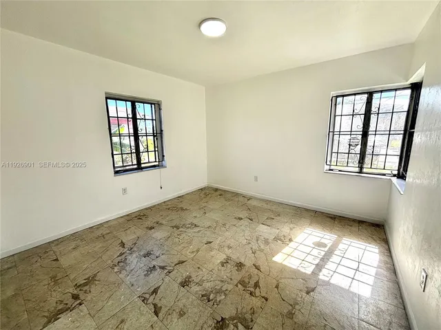 an empty room with windows
