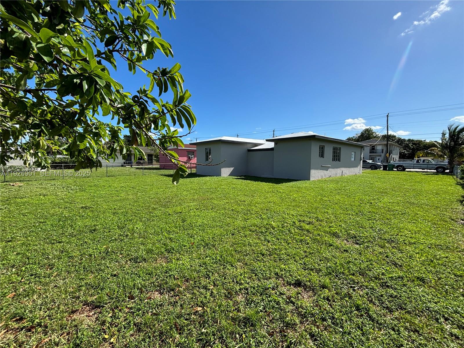 2145 Northwest 64th Street Miami, FL 33147 - Photo 21 of 21 a view of a house with a yard