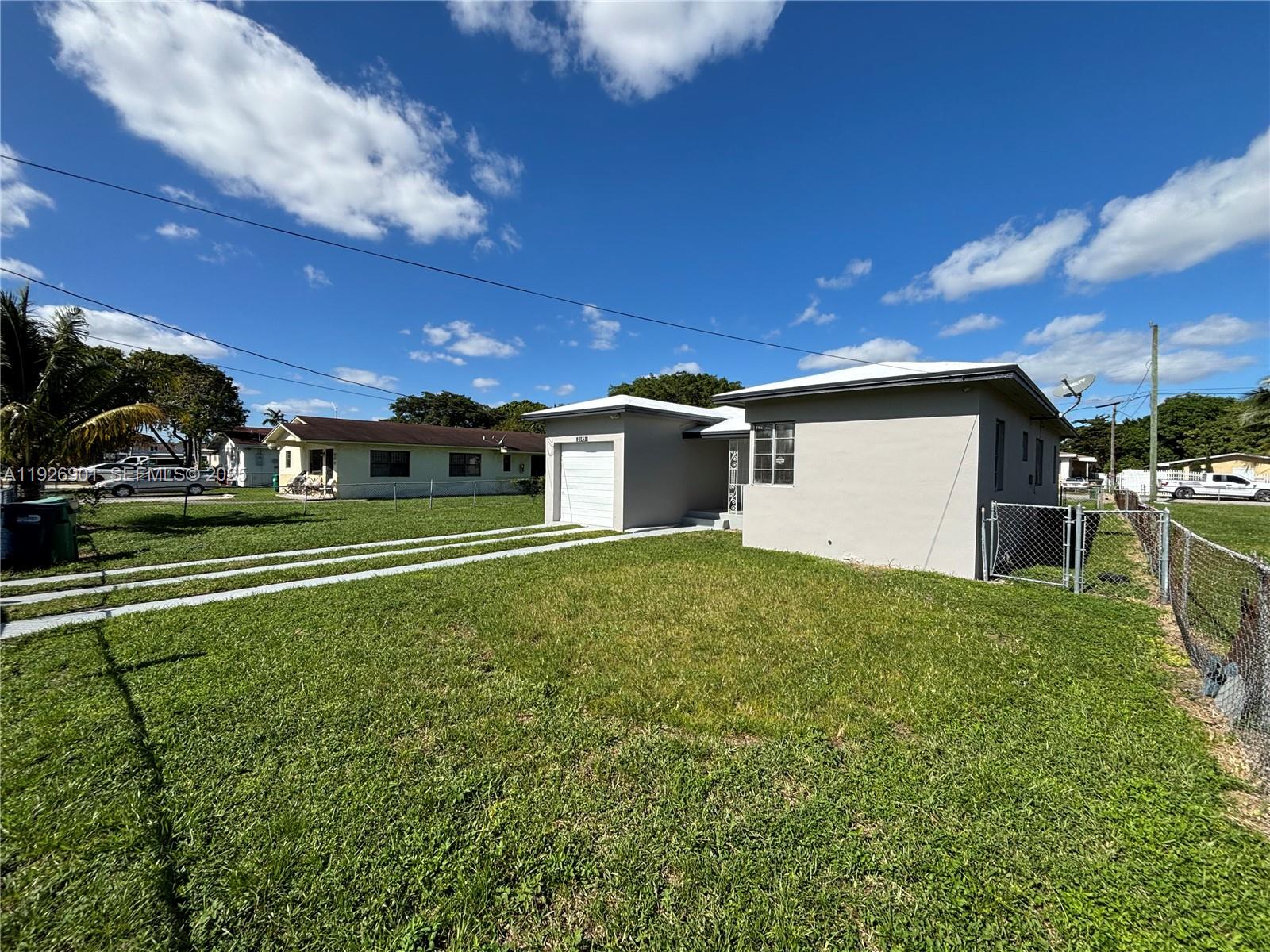 2145 Northwest 64th Street Miami, FL 33147 - Photo 3 of 21 a house view with a backyard space