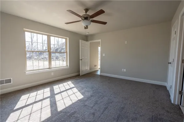 a view of an empty room with a window