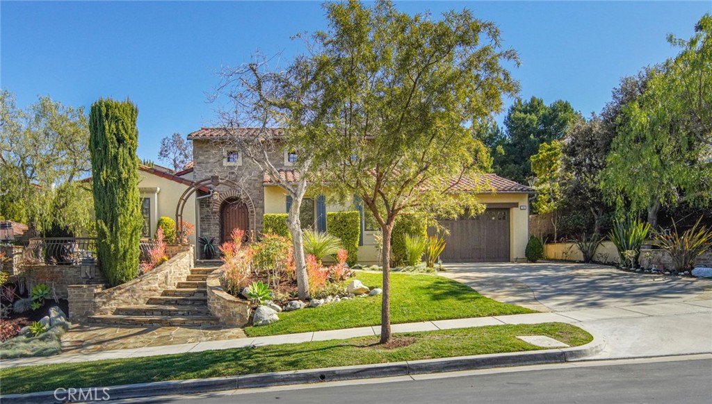 36 Blue Summit Irvine, CA 92603 - Photo 4 of 48 a front view of a house with garden