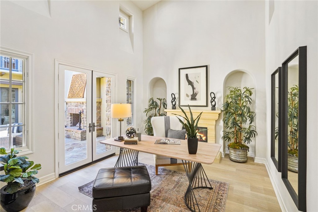 36 Blue Summit Irvine, CA 92603 - Photo 6 of 48 a living room with furniture flowers and a chandelier