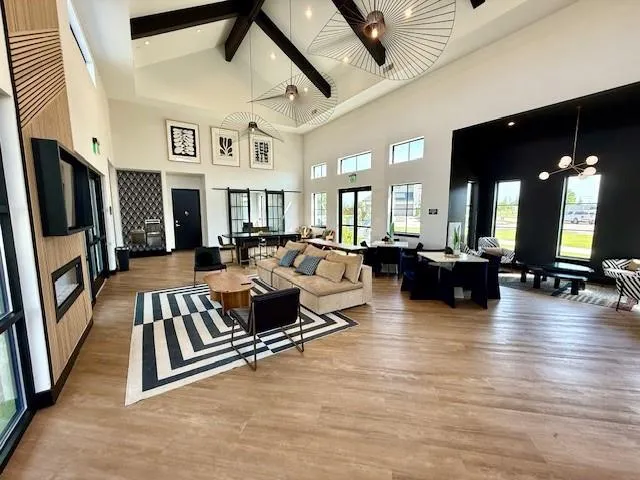 a living room with furniture fireplace and a flat screen tv