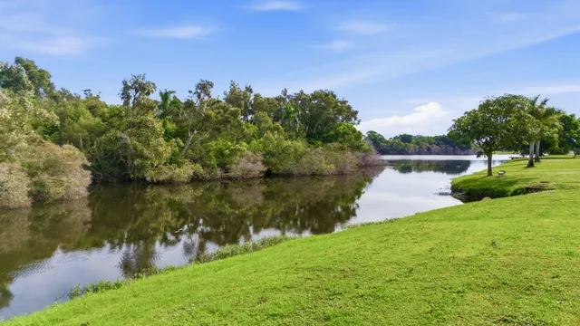 a view of a lake with houses in the back