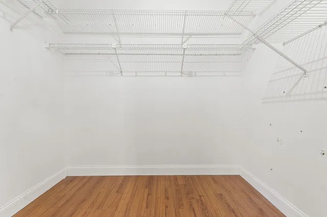 a view of a room with racks on the wall