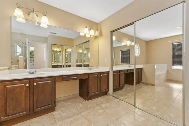 a large kitchen with a large counter top space and stainless steel appliances