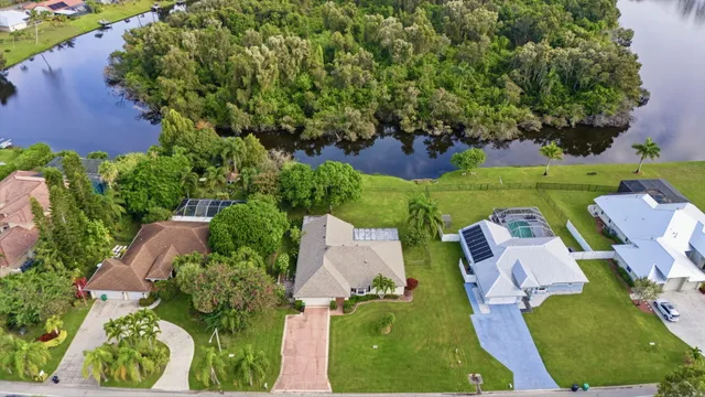 an aerial view of a house with outdoor space and street view