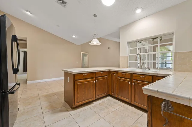 a kitchen with a sink and cabinets