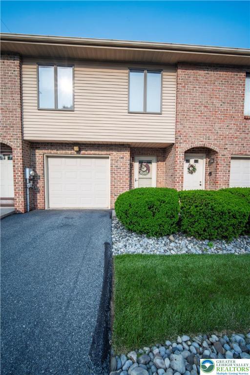443 Vera Circle, Unit K Bethlehem, PA 18017 - Photo 1 of 24 a front view of a house with a garden