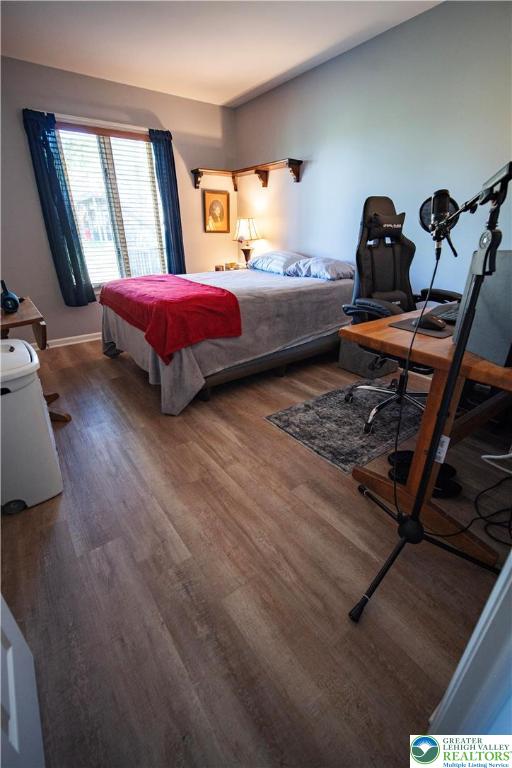 443 Vera Circle, Unit K Bethlehem, PA 18017 - Photo 15 of 24 a bedroom with a bed and wooden floor